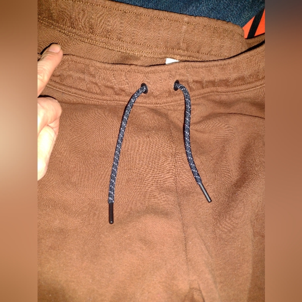 large brown Nike  sweats
